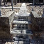 Moulded GRP grating for trench access