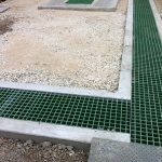 Moulded square mesh GRP grating in a composite Cable Trench