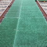 Moulded GRP square mesh grating in a composite Cable Trench